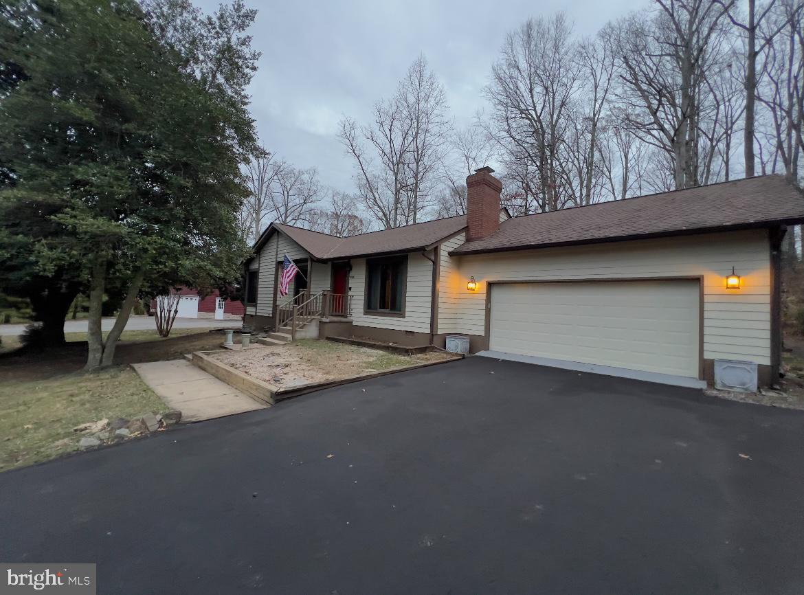 a front view of a house with garage