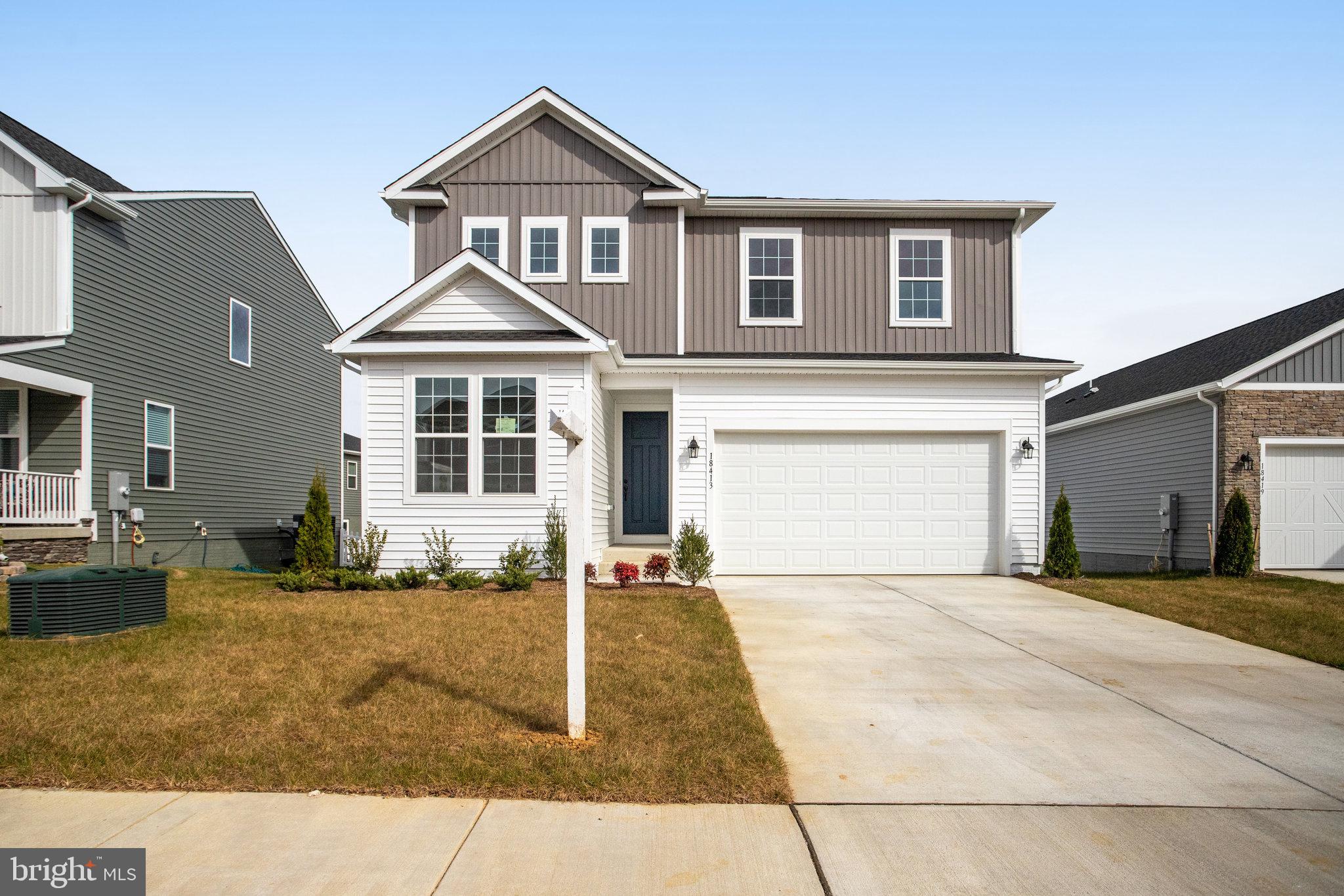 a front view of a house with yard