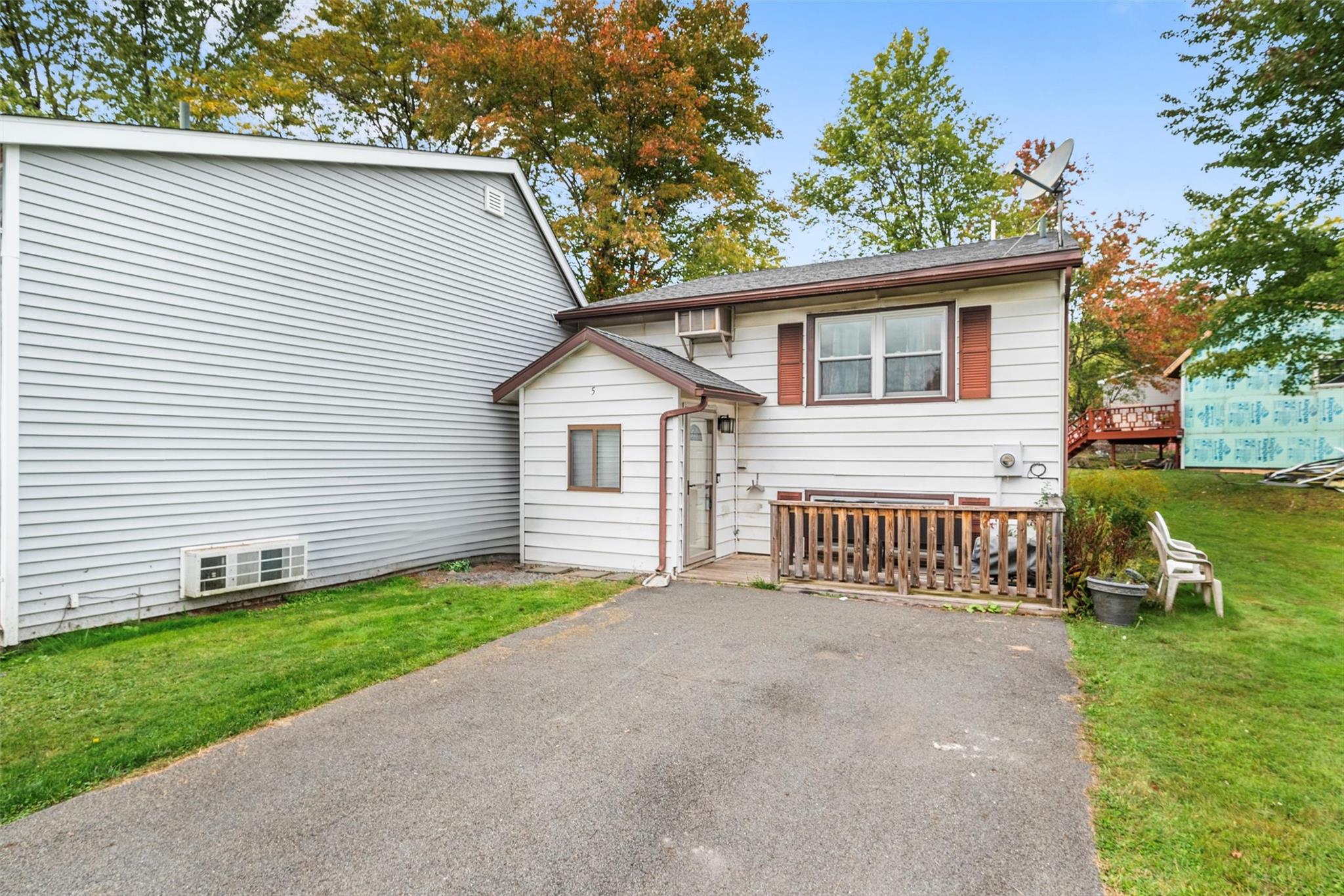 a view of a house with a yard and a garden