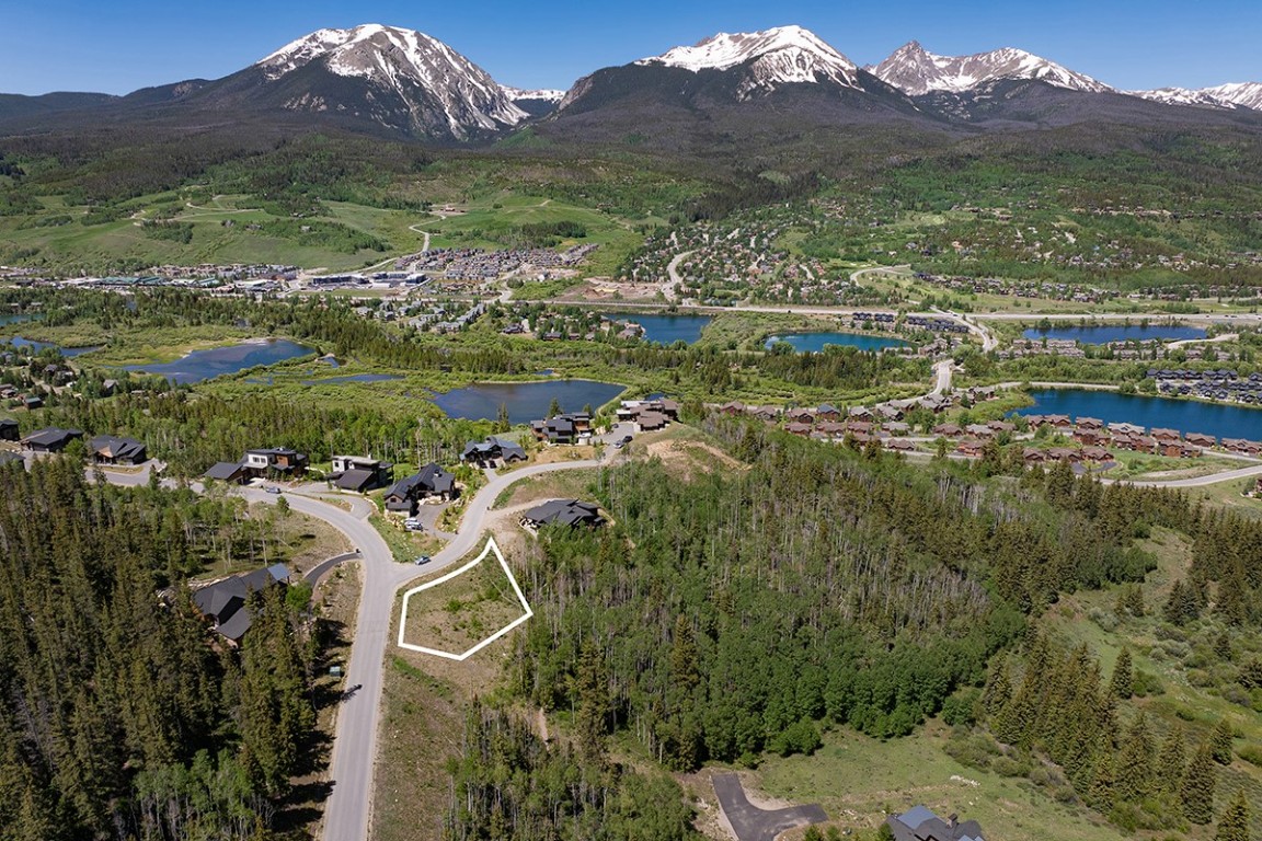 a view of a city with mountains in the background