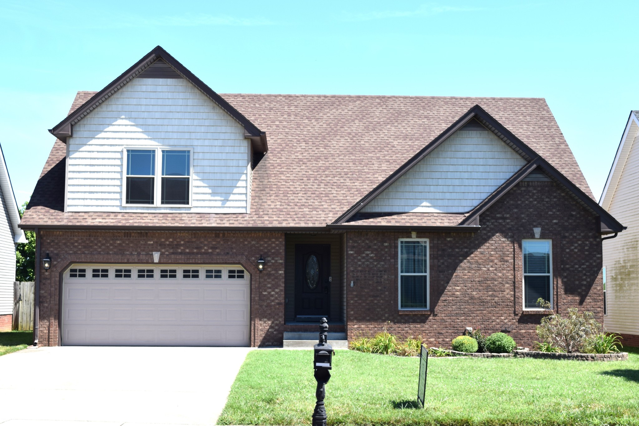 a front view of a house with garden