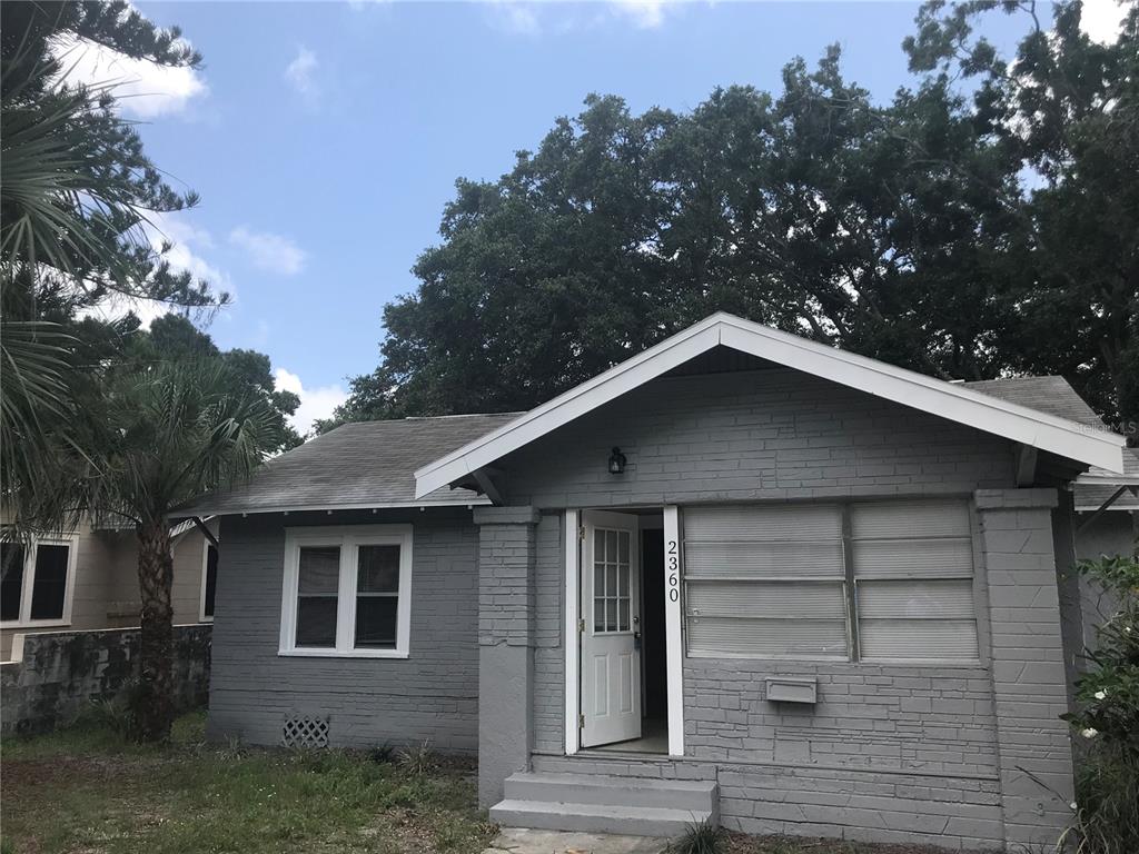 a front view of a house with garage