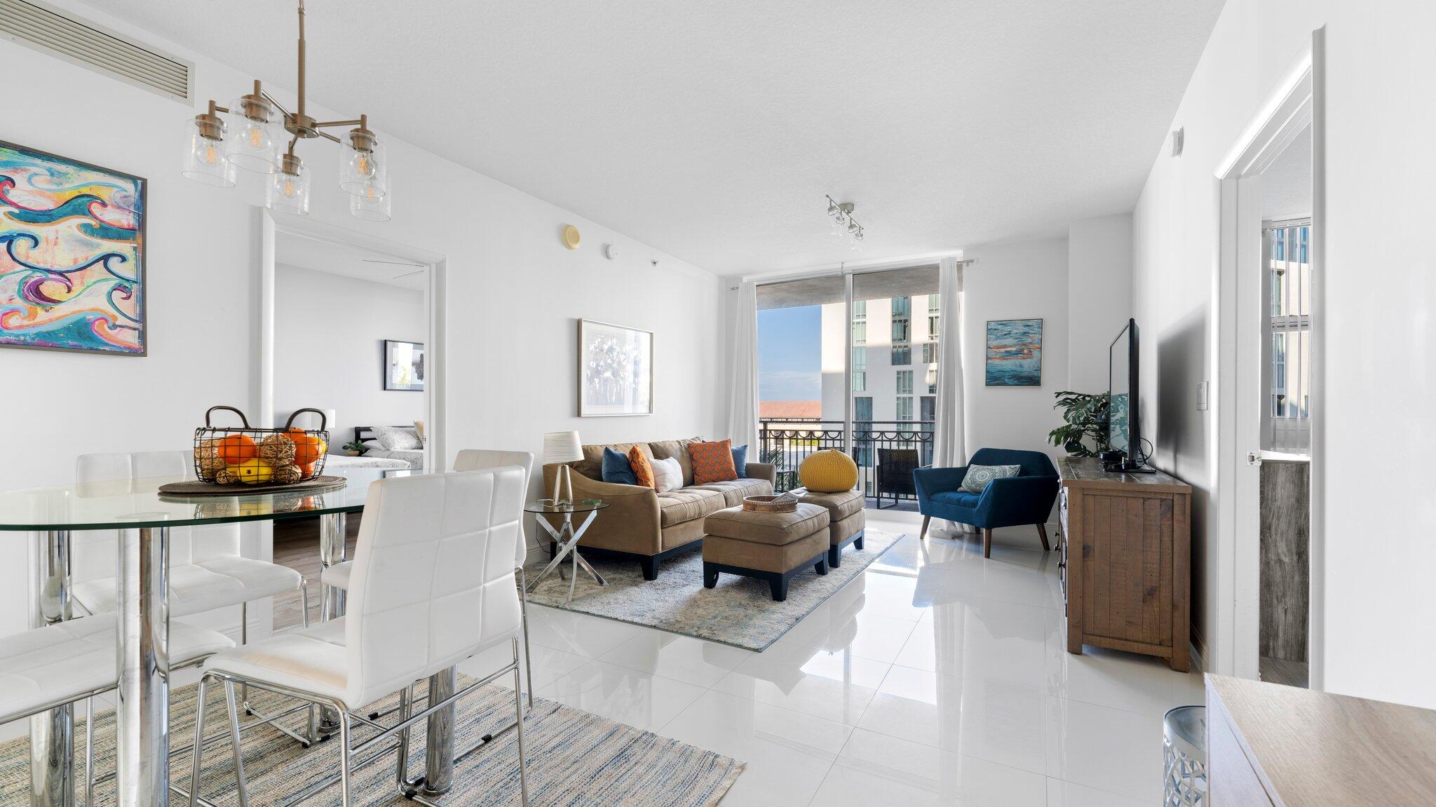 a living room with furniture or couch and a dresser