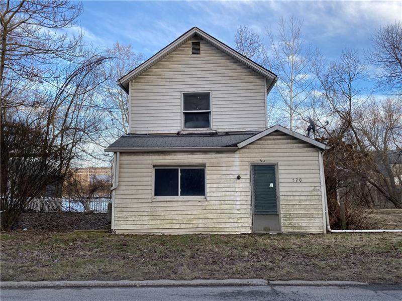 a front view of a house with garage