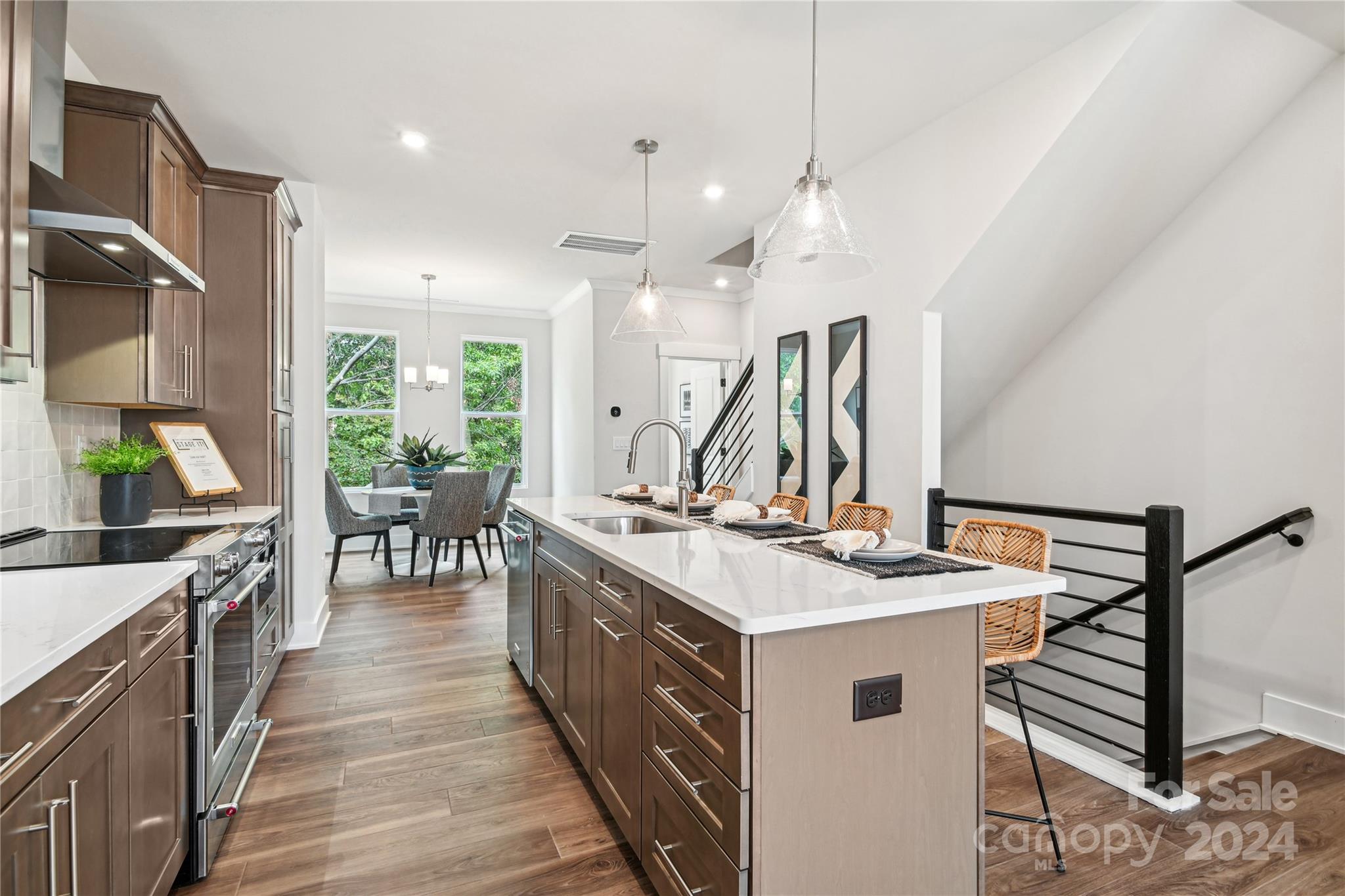 a kitchen with a sink stove and cabinets