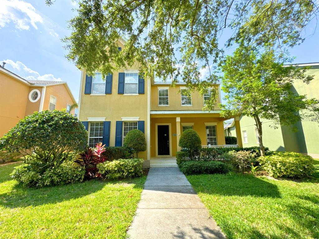 a front view of a house with garden