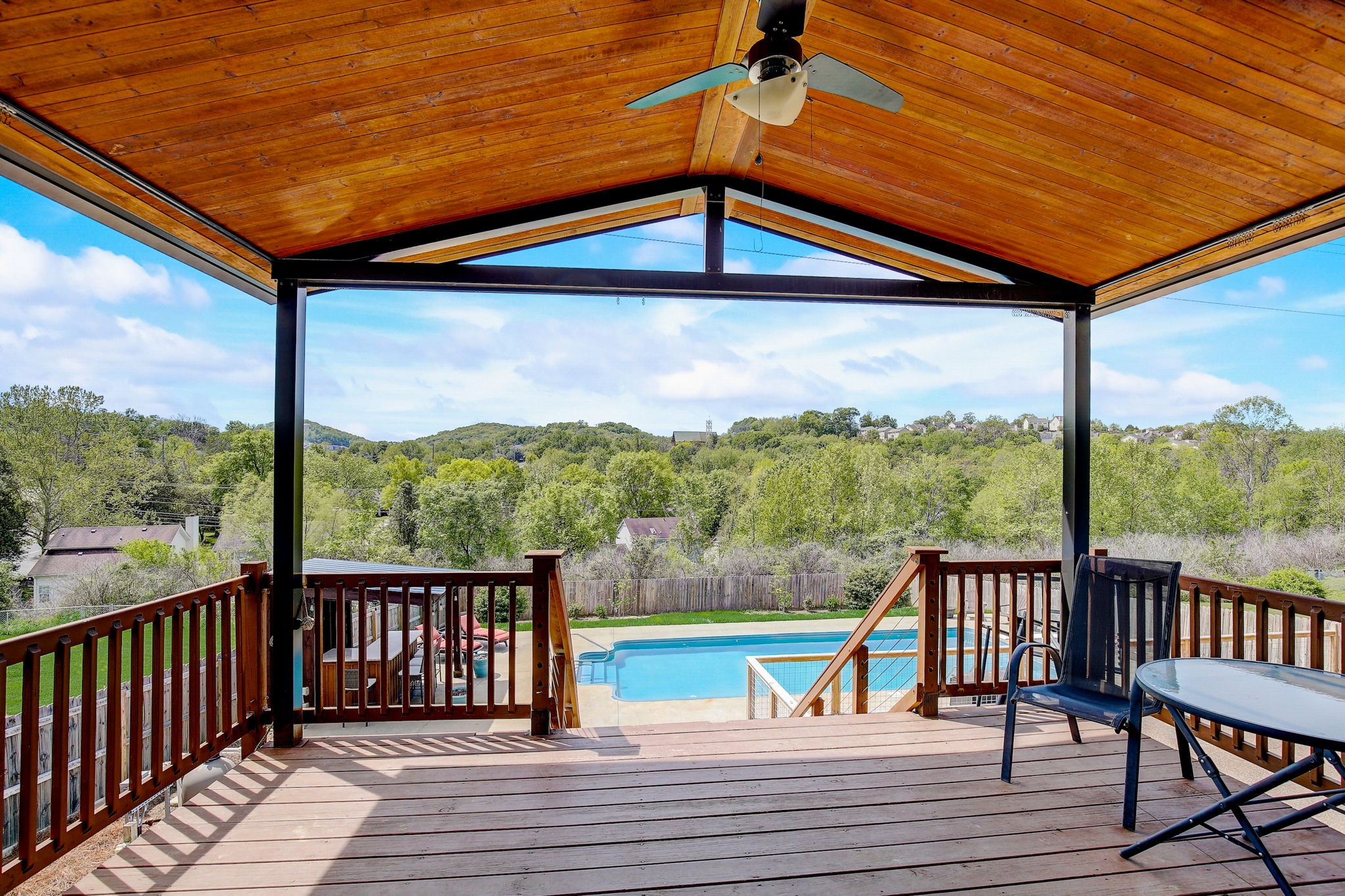 a view of a balcony with wooden floor