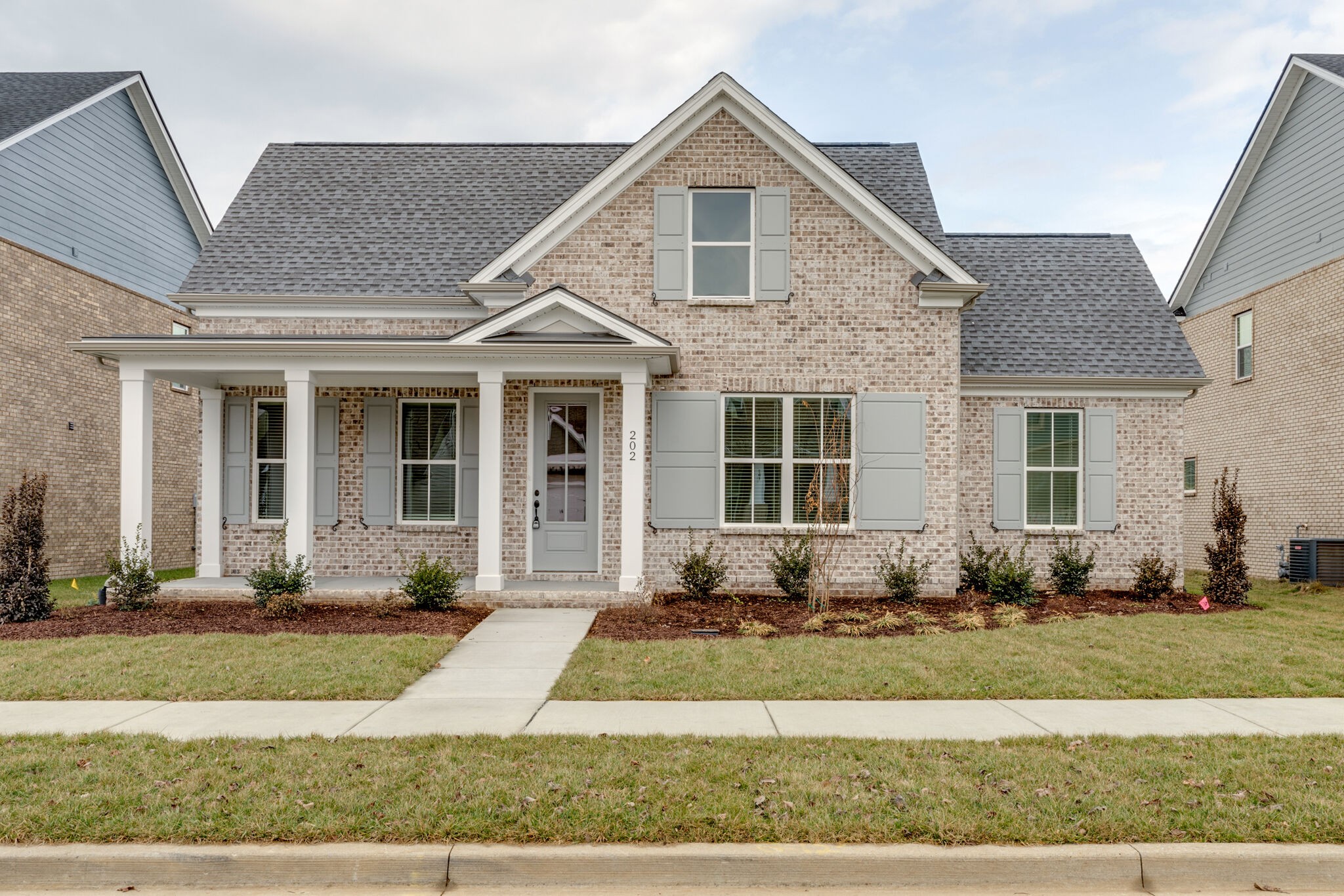 a front view of a house with yard