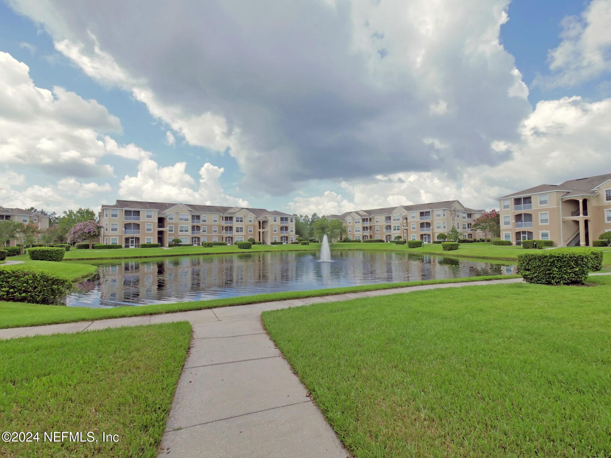 a view of a lake with a big yard