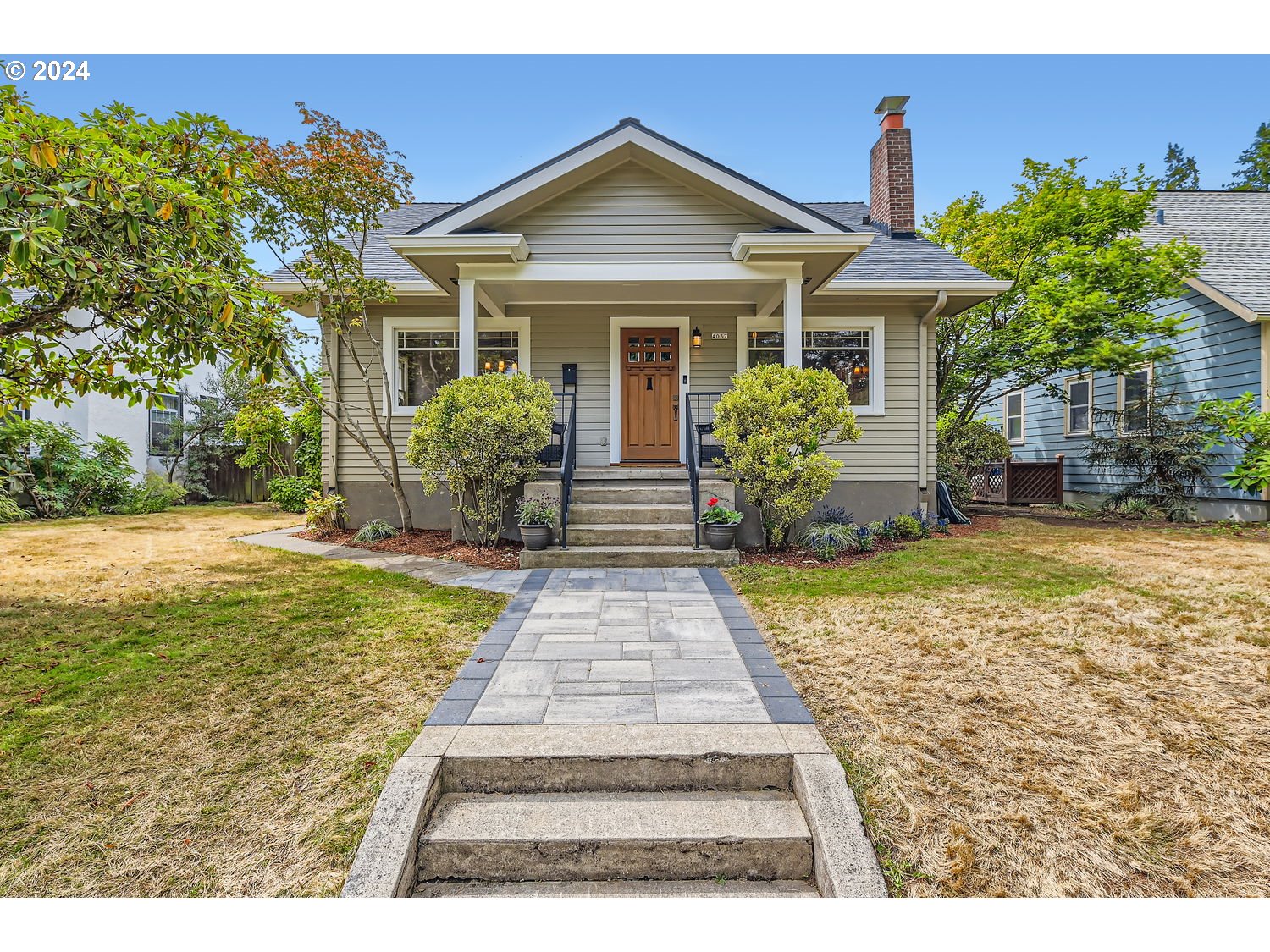 a front view of a house with garden