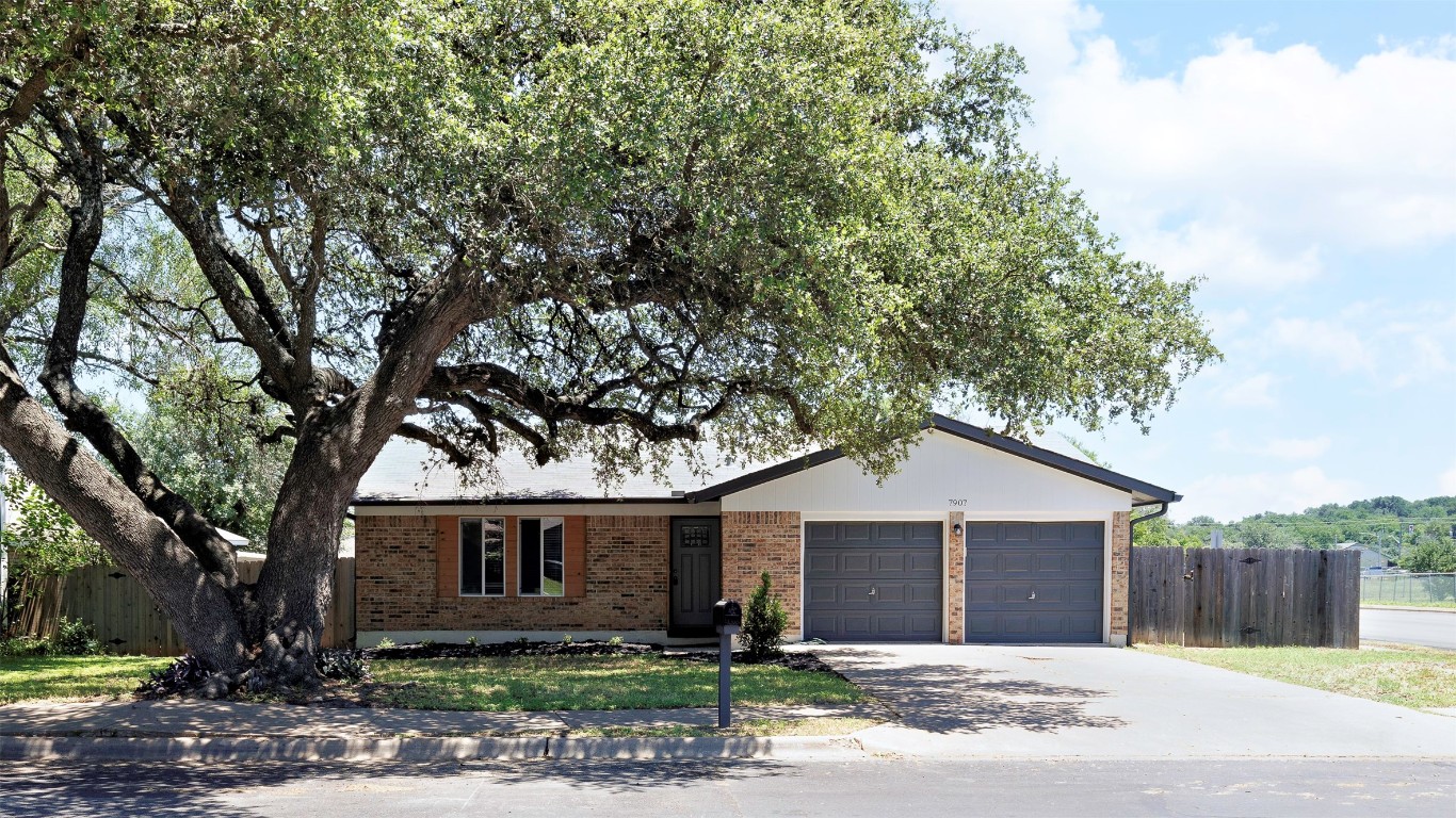 a front view of a house with a garage