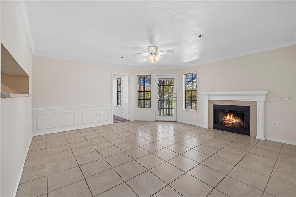 a view of an empty room with a fireplace