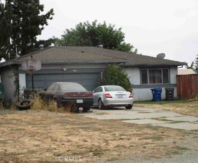 a car parked in front of a house