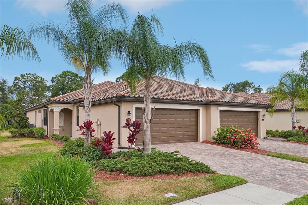 a front view of house with yard and green space