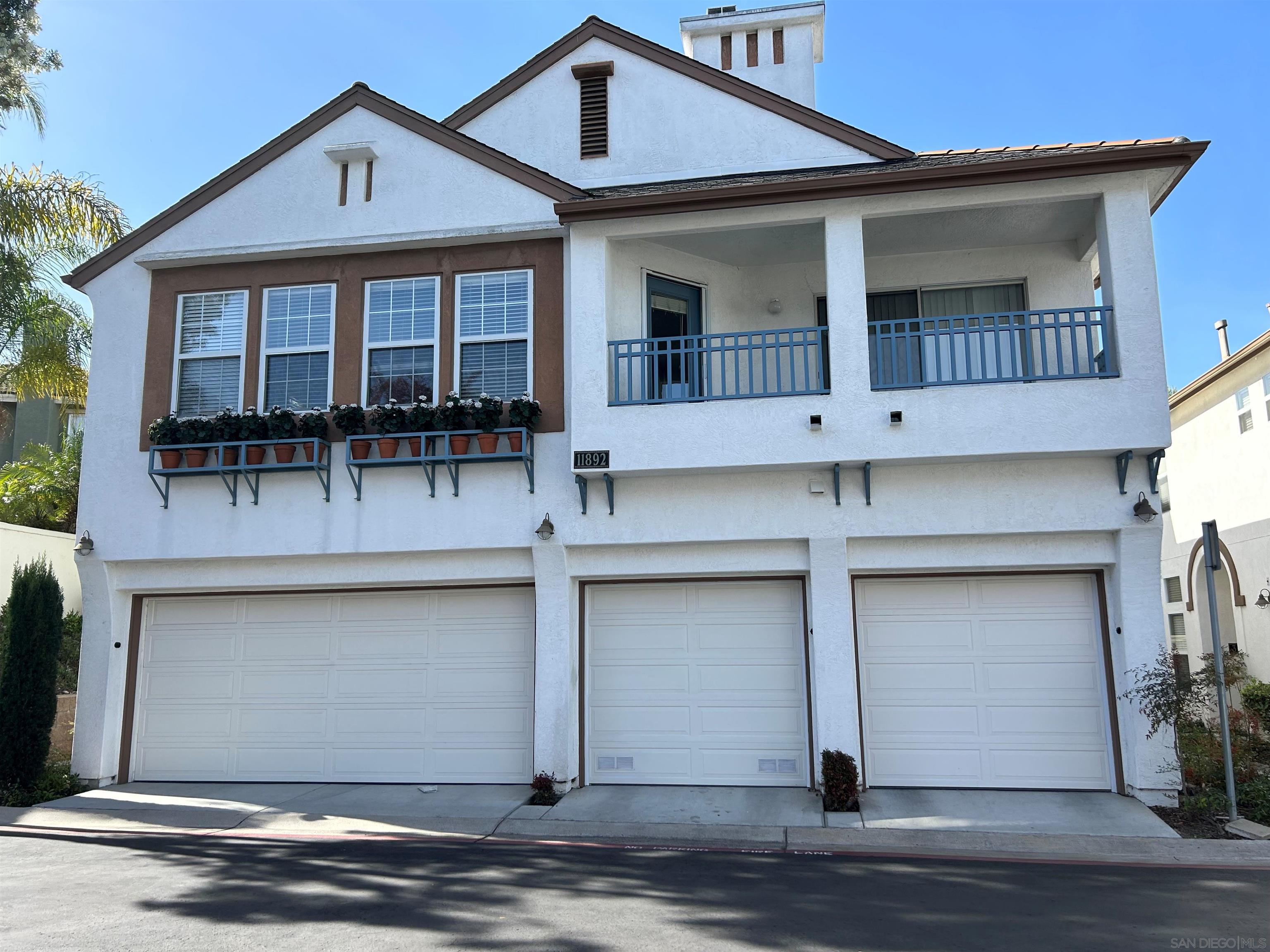 a front view of a house with garage