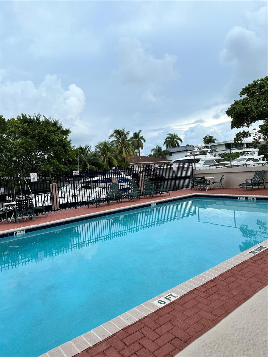 a view of a swimming pool and a yard