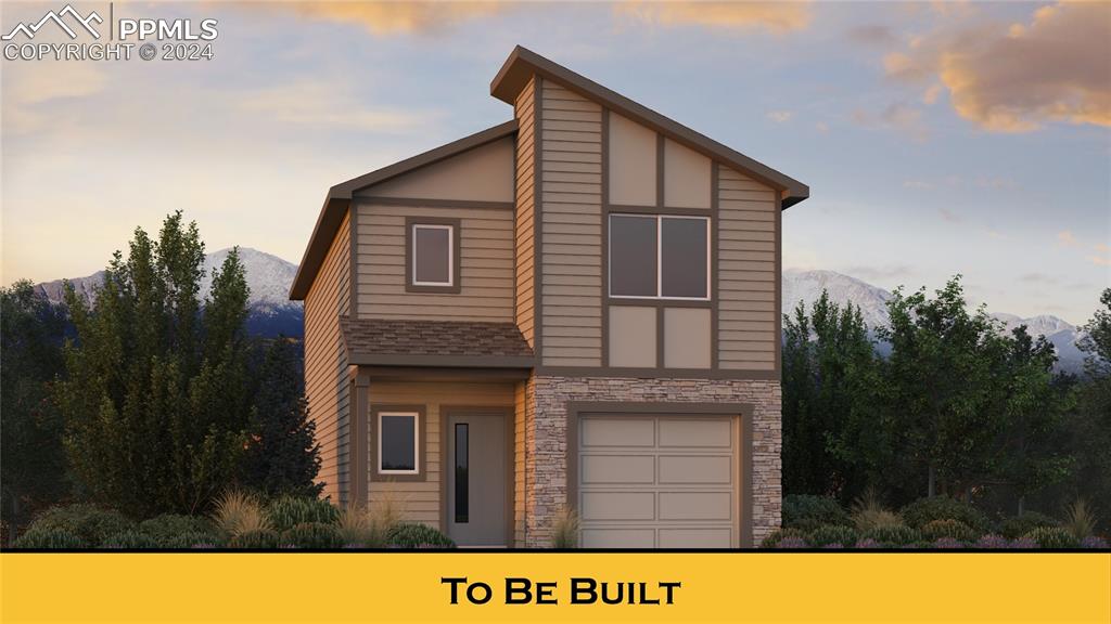 View of front facade featuring a garage and a mountain view