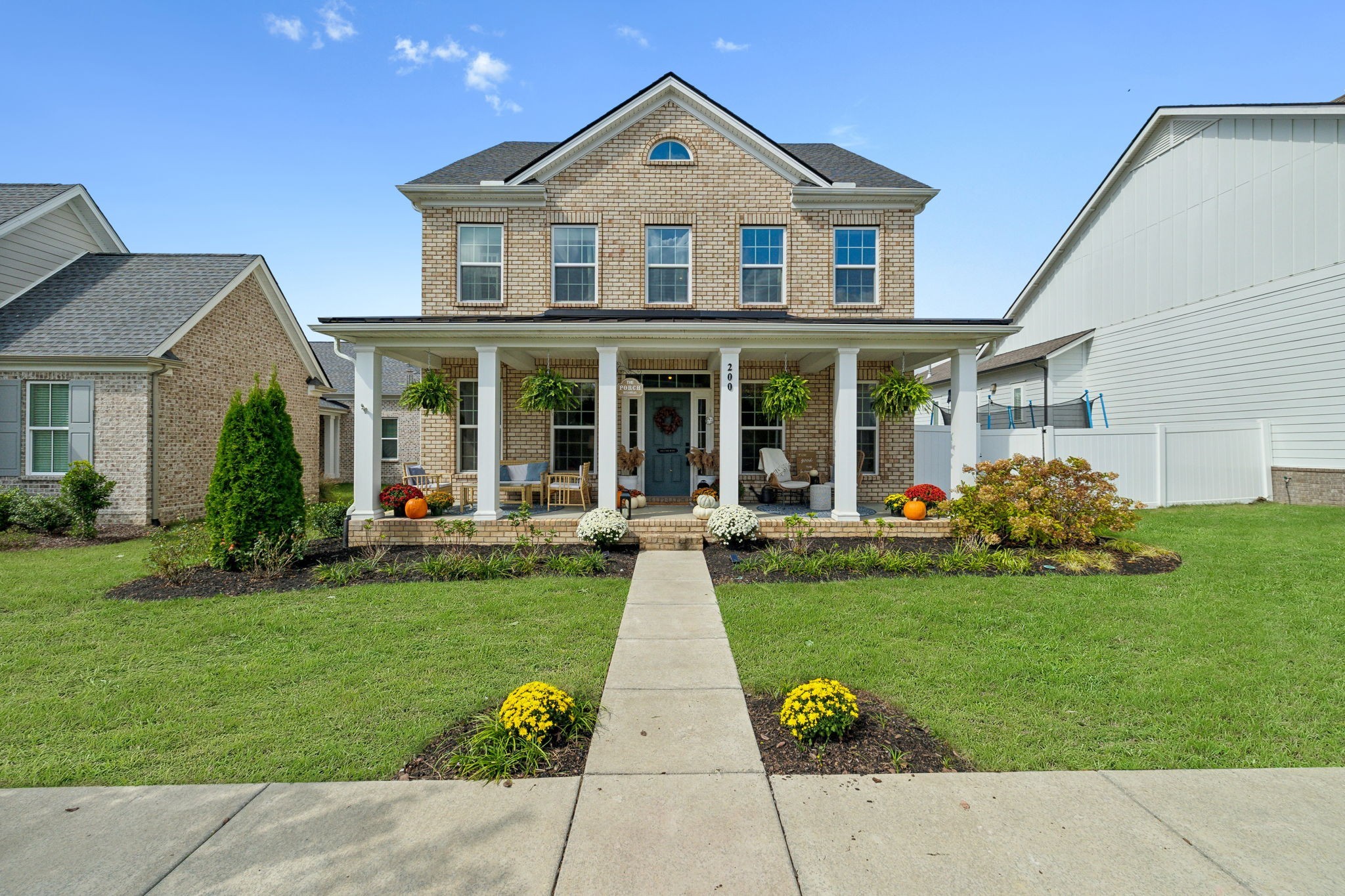 a front view of a house with garden