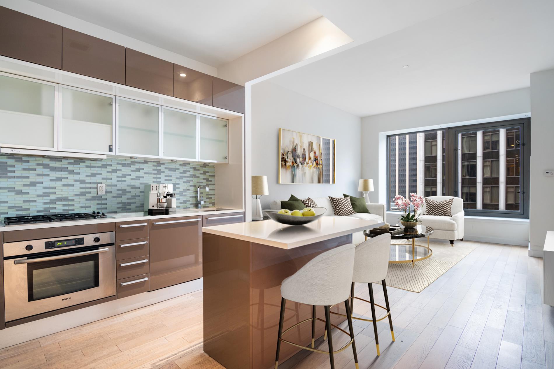 a kitchen with granite countertop a stove a sink and chairs