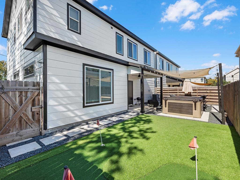 a view of house with backyard