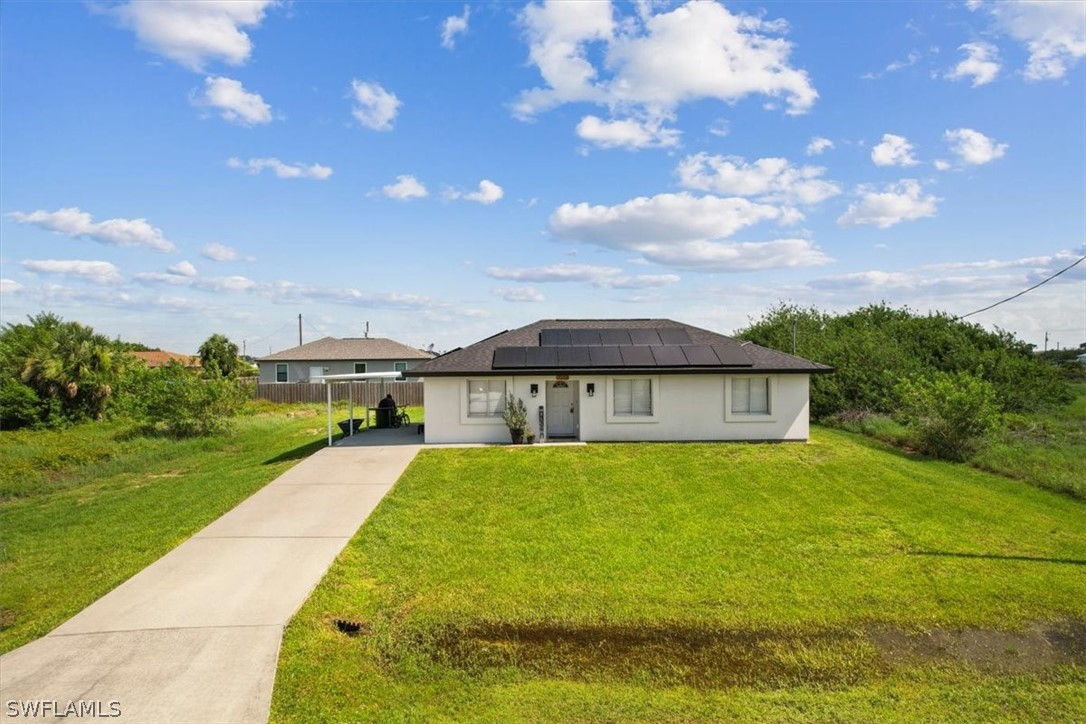 a view of a house with a yard