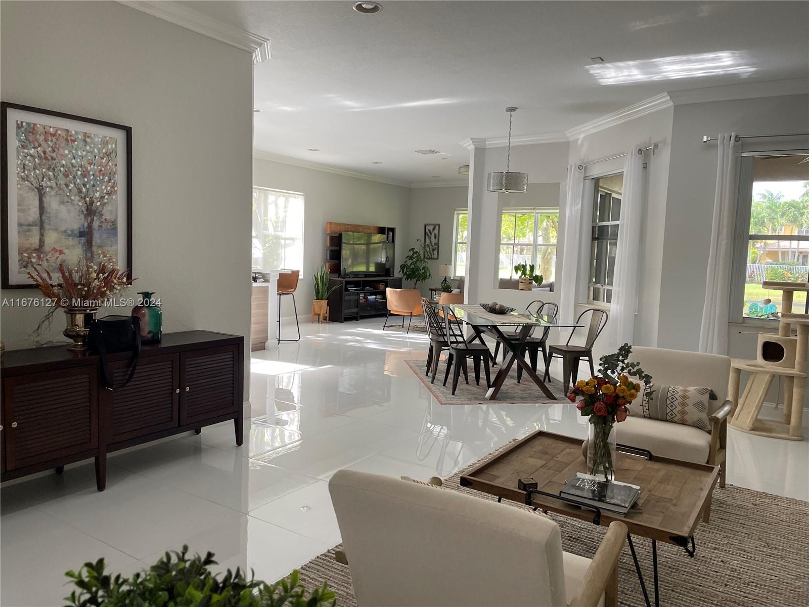 a living room with furniture and flat screen tv