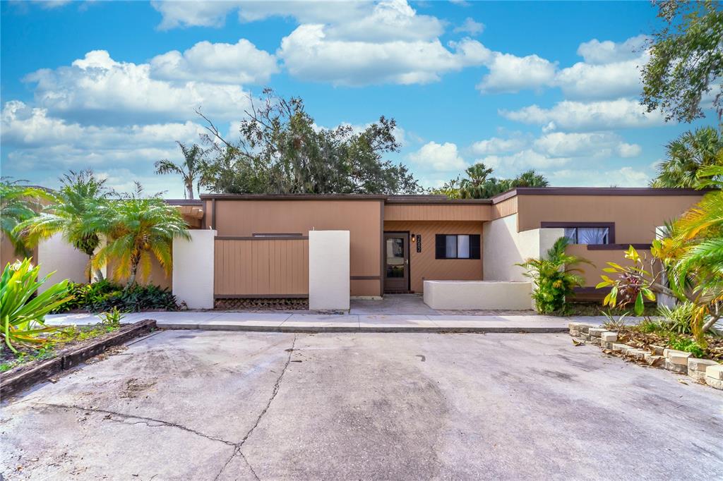 front view of a house with a yard and a garage