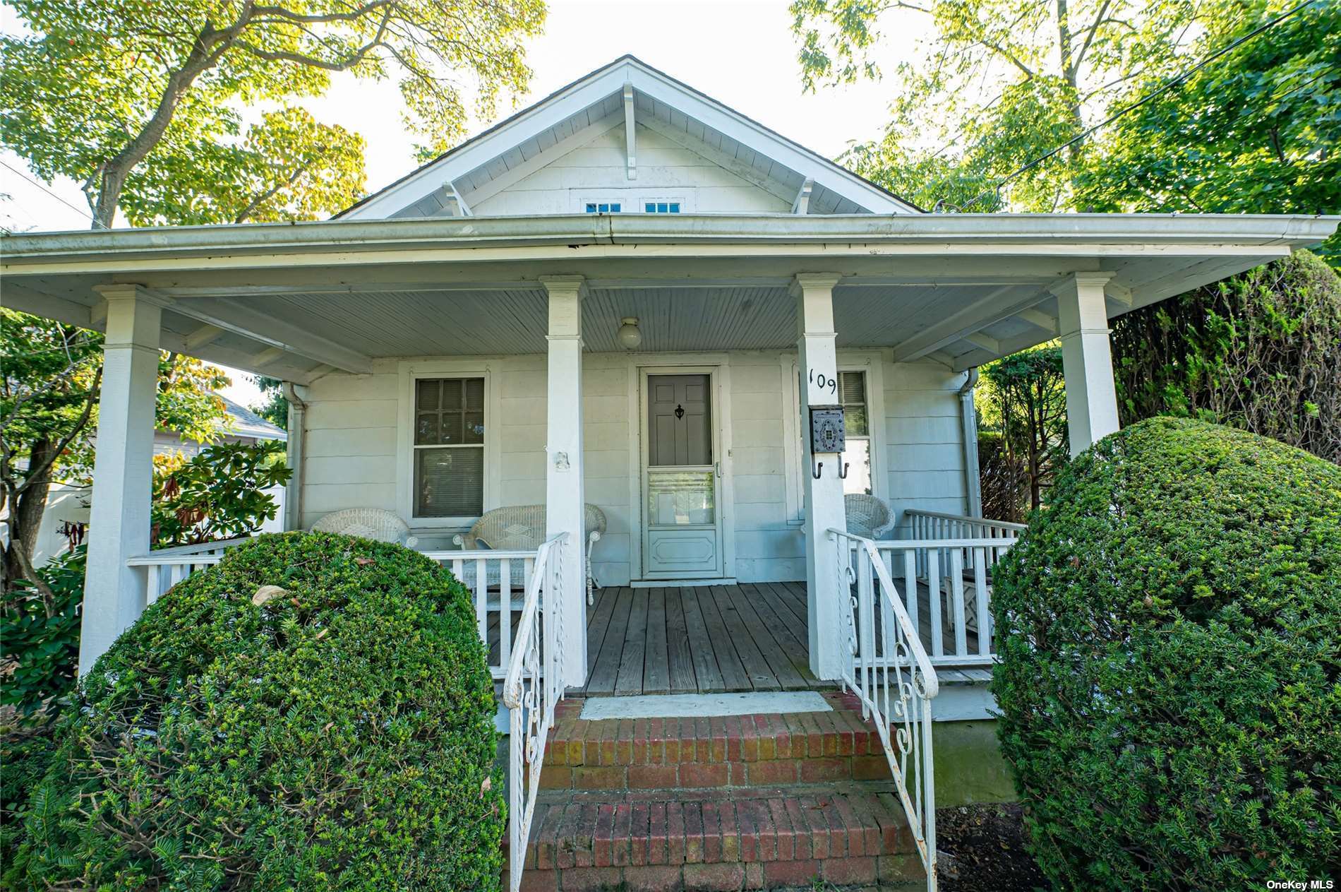 a front view of a house with a porch