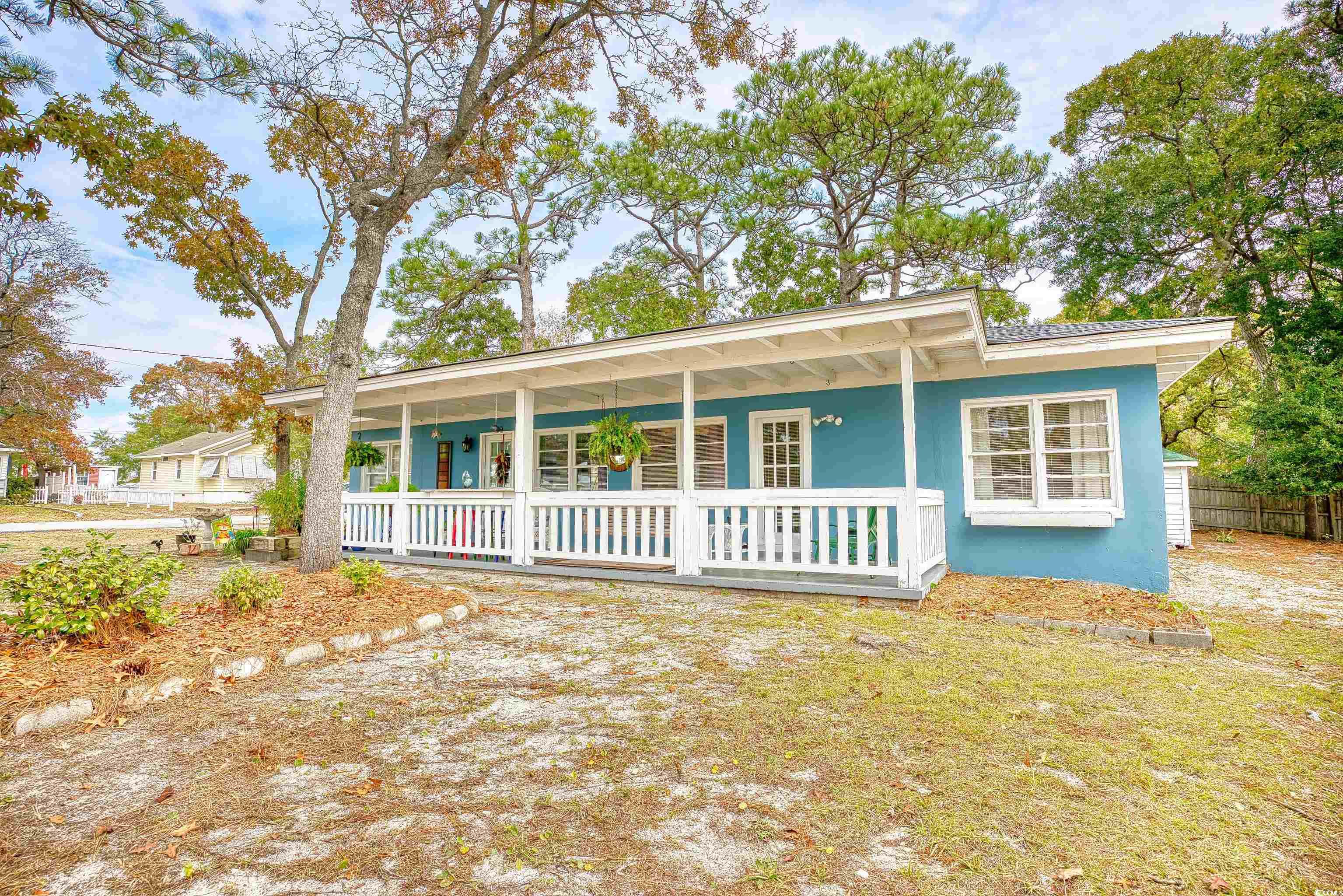 Ranch-style house featuring covered porch