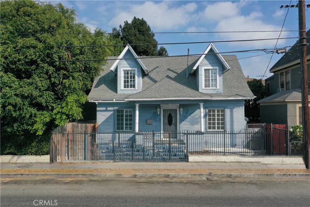 a view of a brick house with a street