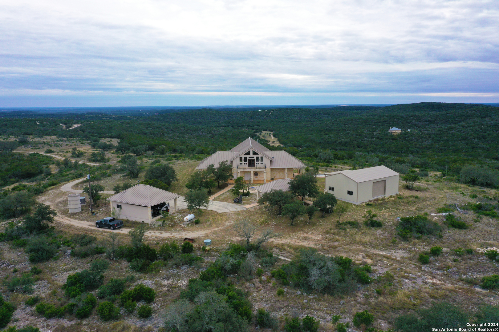 an aerial view of a house with a garden