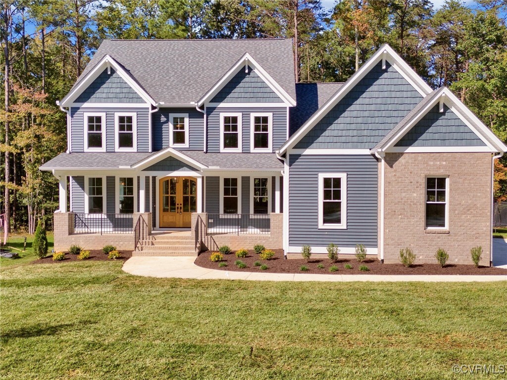 a front view of house with yard and green space