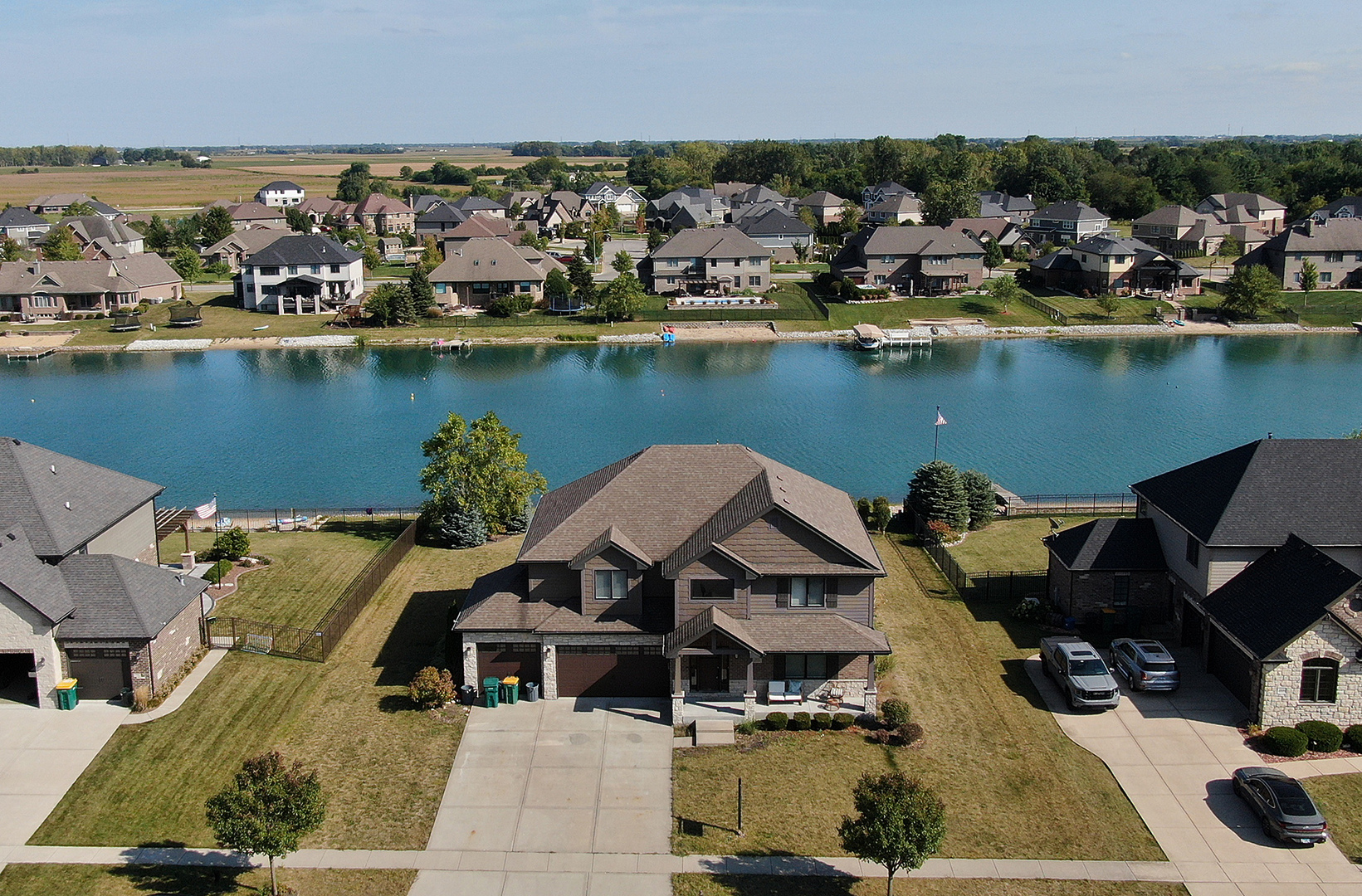 an aerial view of a house with a lake view