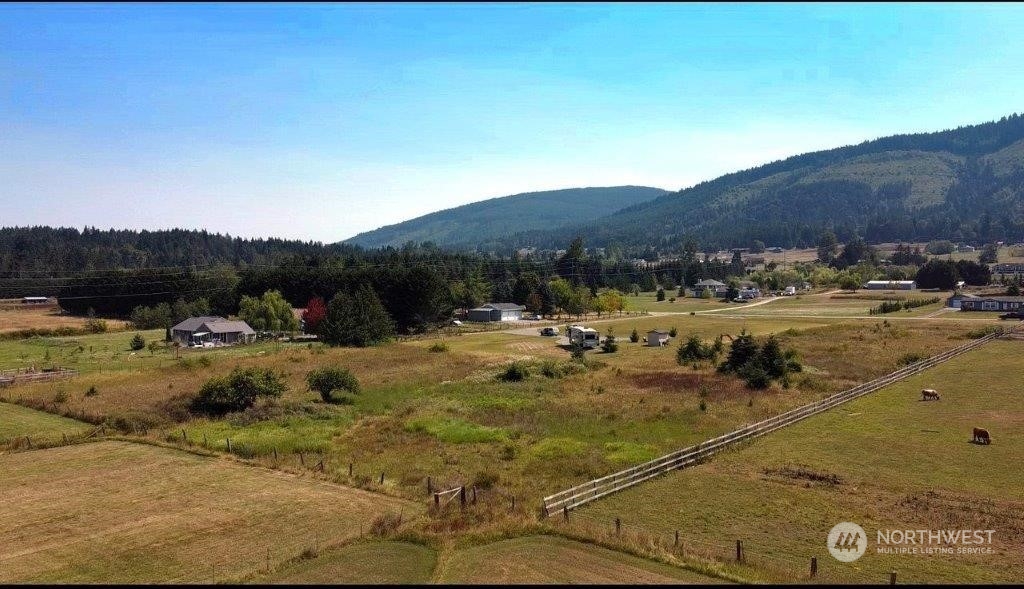 a view of a town with mountains in the background