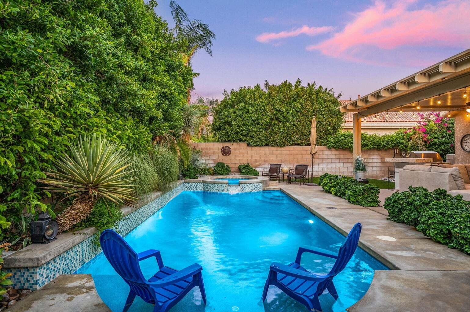 a view of a swimming pool with a lounge chairs