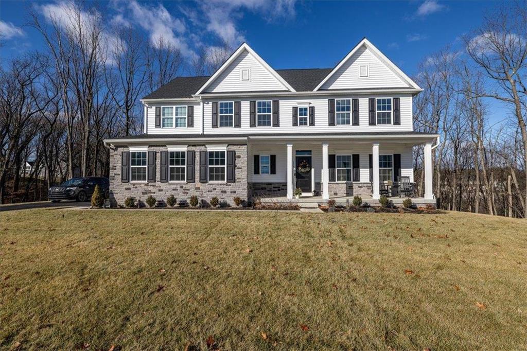 front view of a house with a yard