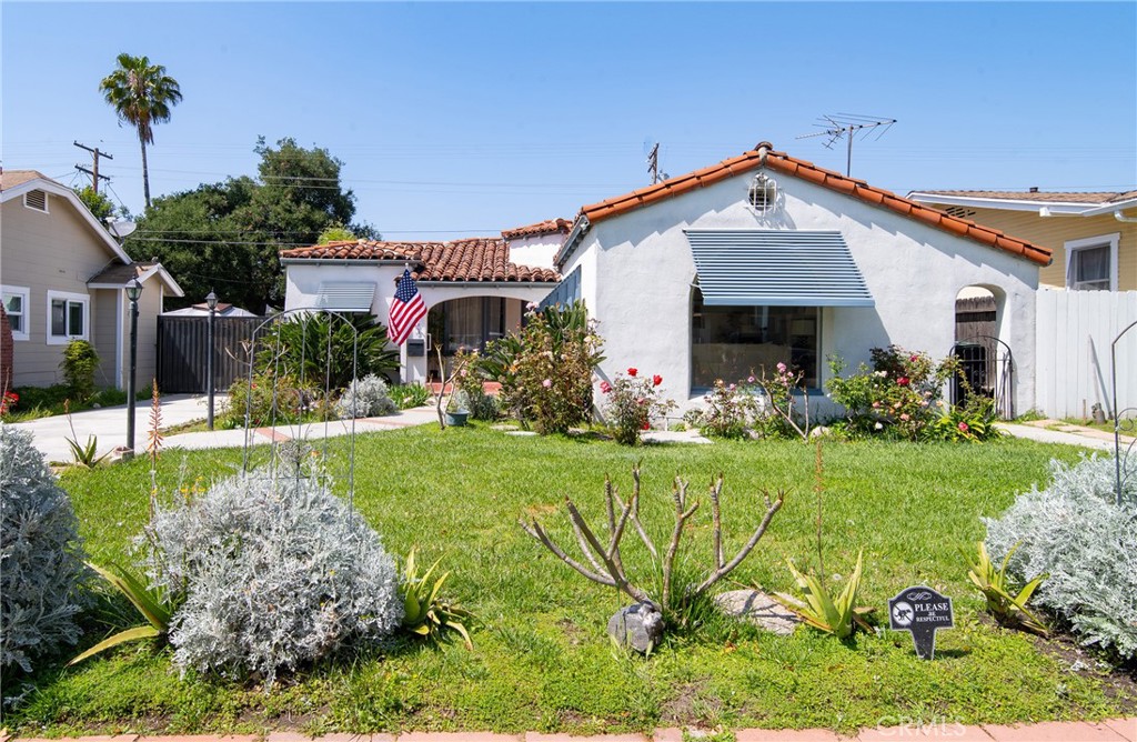 a front view of a house with garden