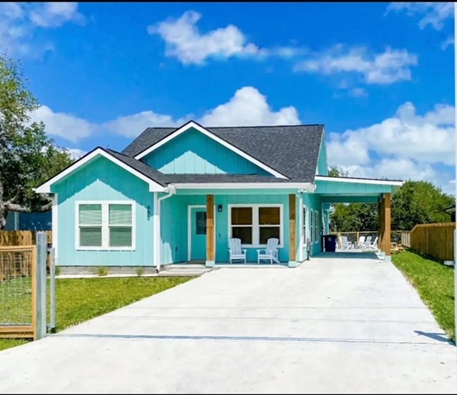 a view of house with yard and entertaining space