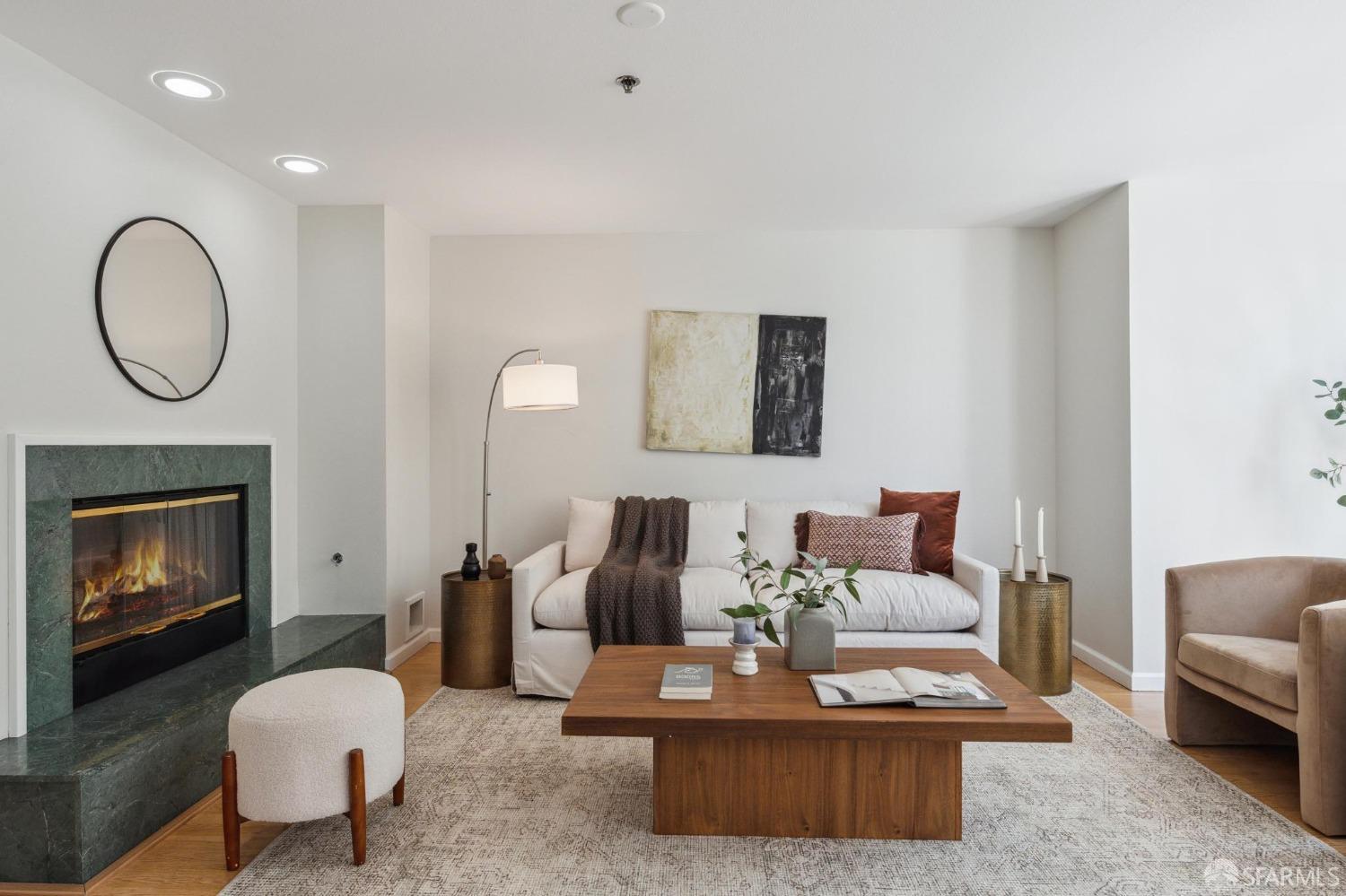 a living room with furniture a fireplace and a fireplace