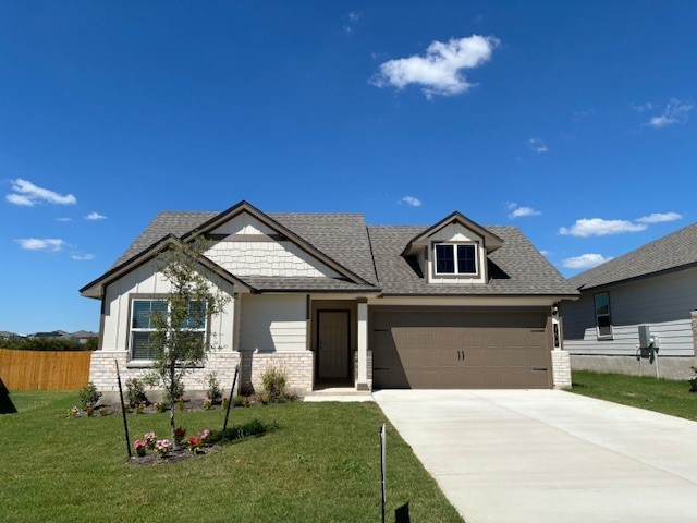 a front view of a house with a yard fire pit and outdoor seating