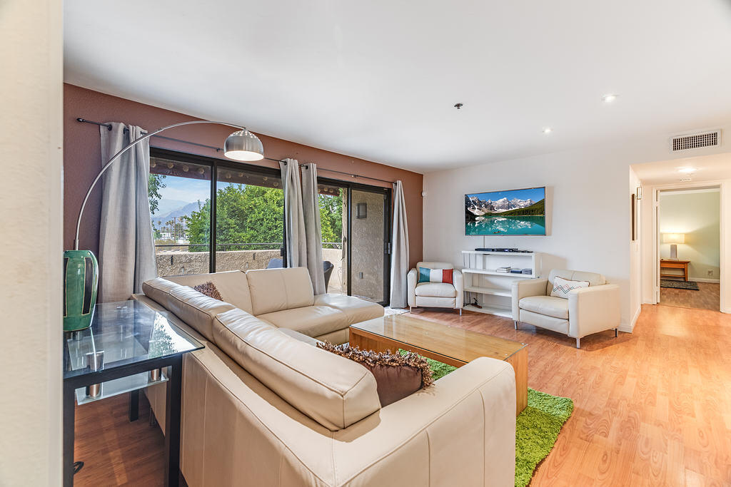 a living room with furniture and a large window