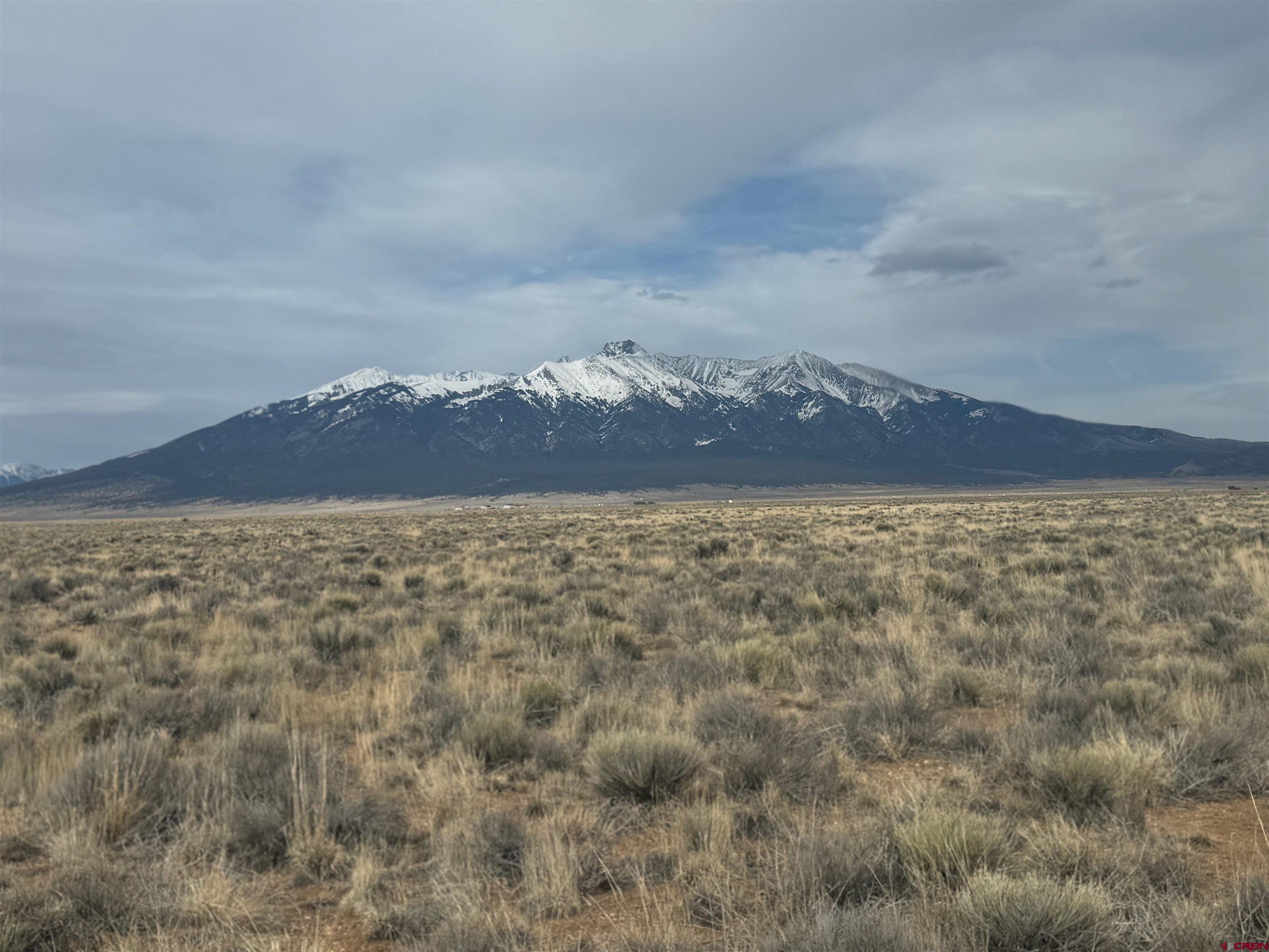 a view of a dry yard with mountain