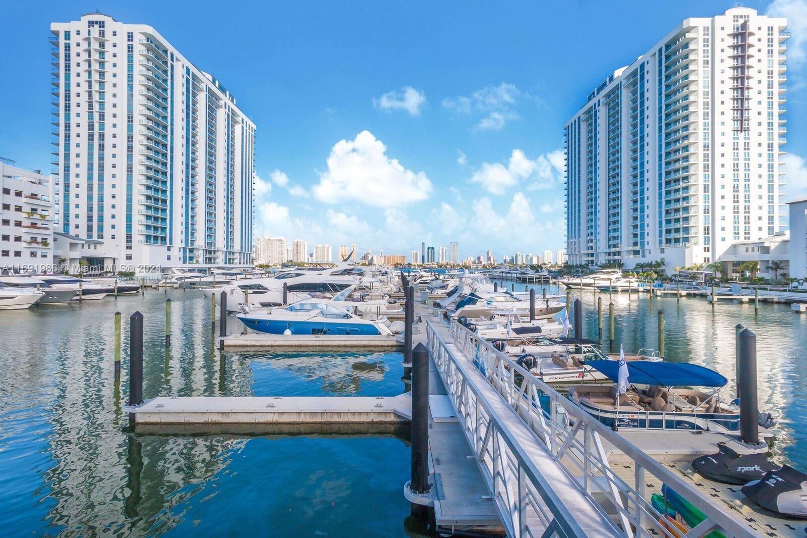 a view of a lake with tall buildings