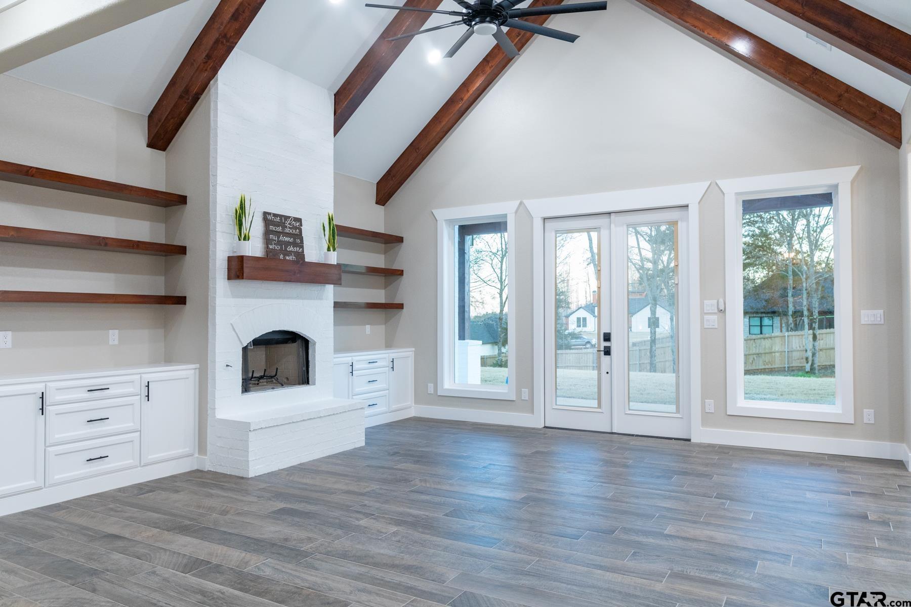 a view of a livingroom with wooden floor