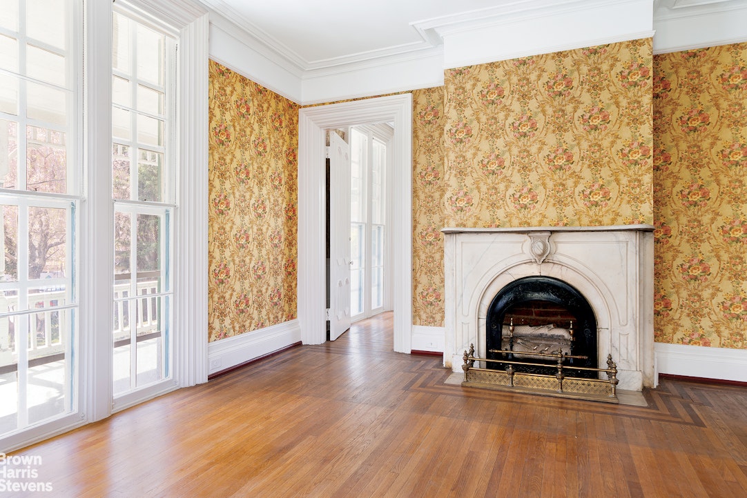 a view of a livingroom with furniture and a fireplace