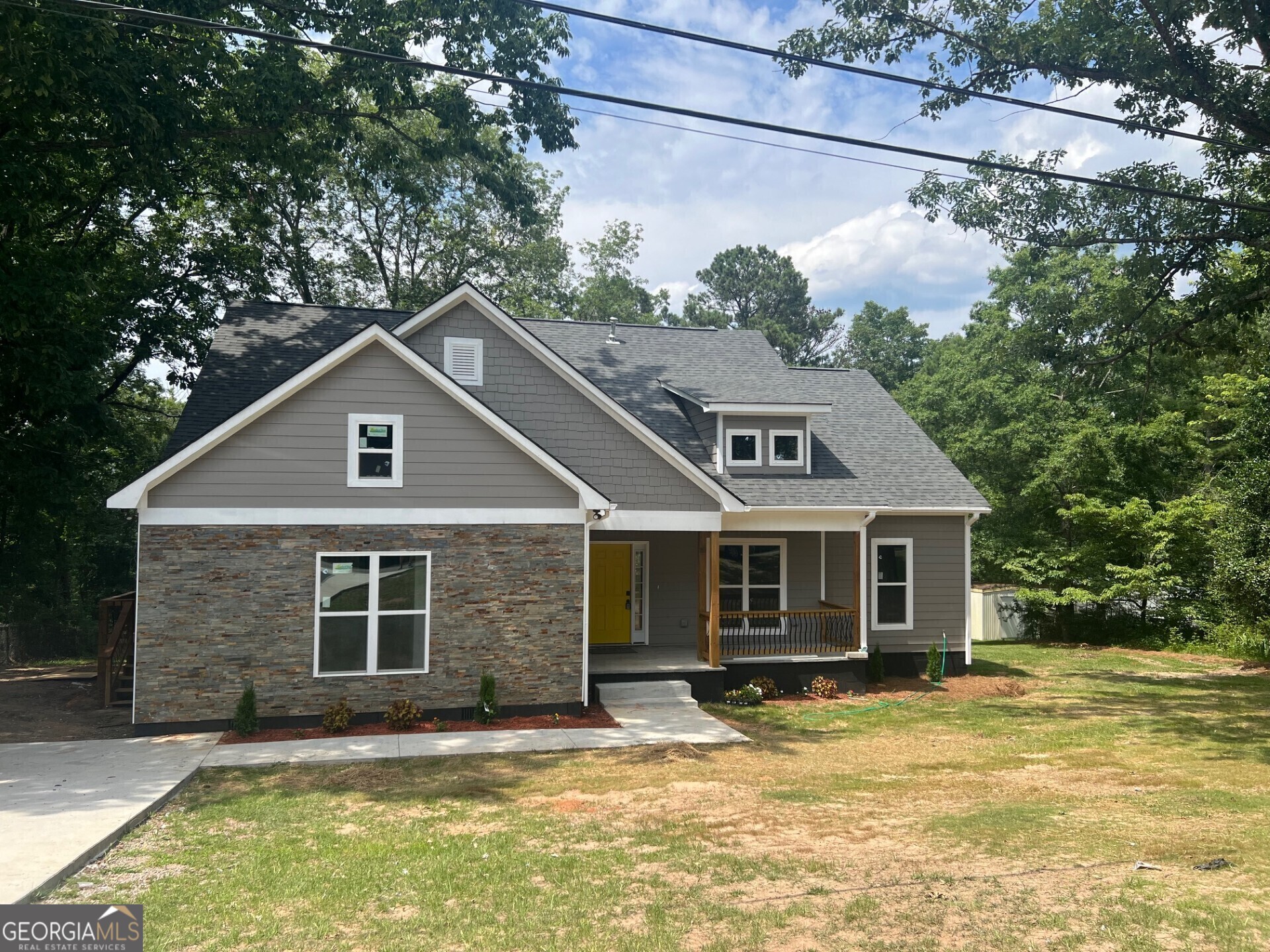 a house with trees in the background