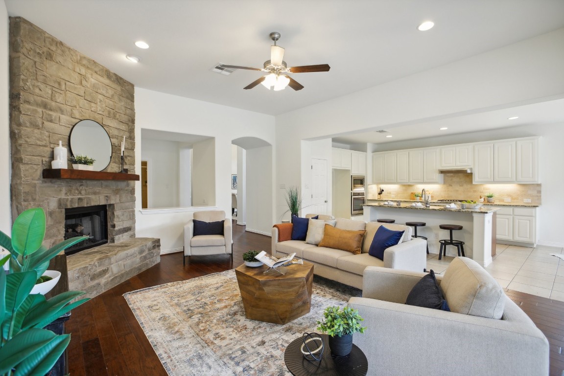 a living room with furniture and a fireplace