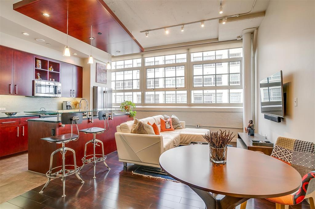 a large kitchen with a table and chairs