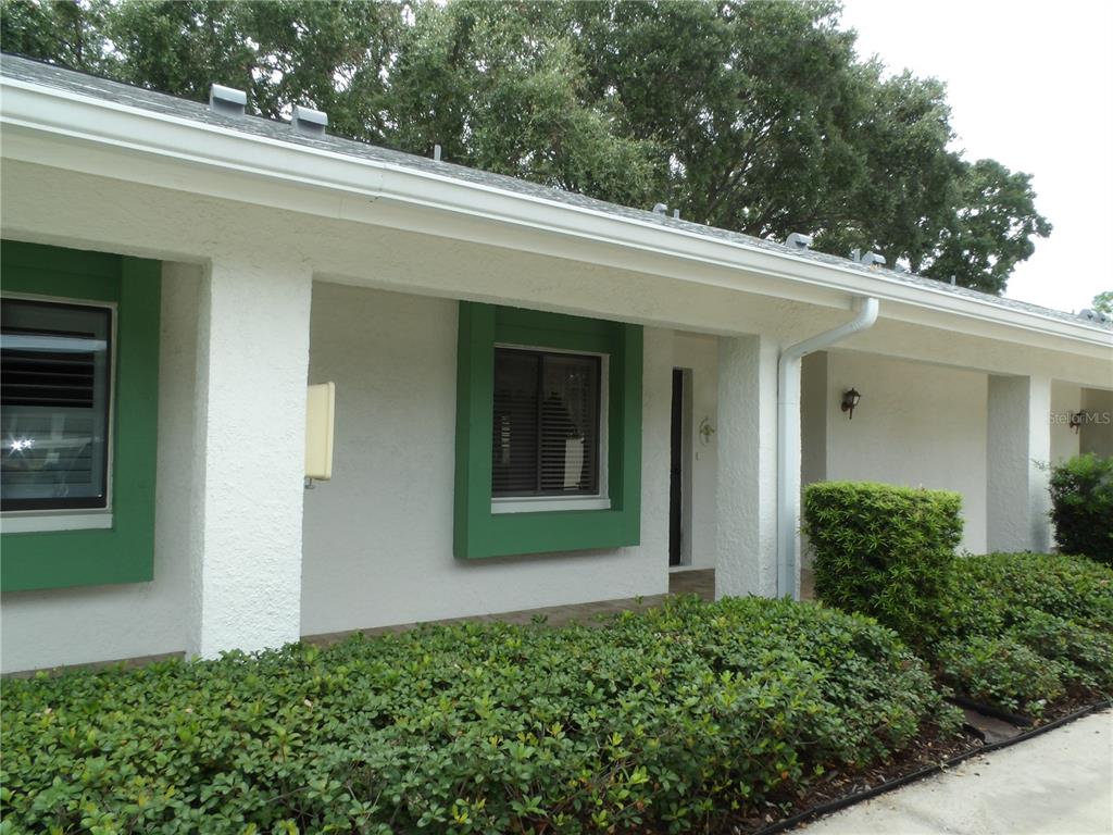 a view of a house with a small yard