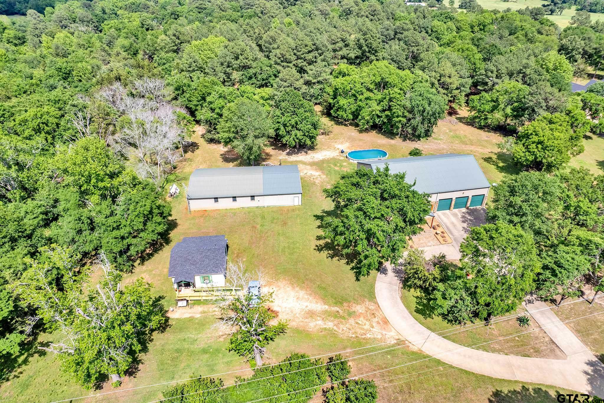 an aerial view of residential house with outdoor space